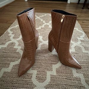 New with box size 8.5 pointed toe mid calf boots!